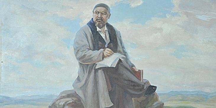 Кітап ұстап отырған Абай Құнанбайұлы